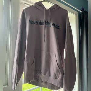 NEVER DRINKING AGAIN HOODIE